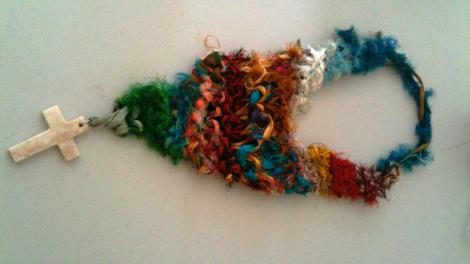 A piece of handmade jewellery on a white table